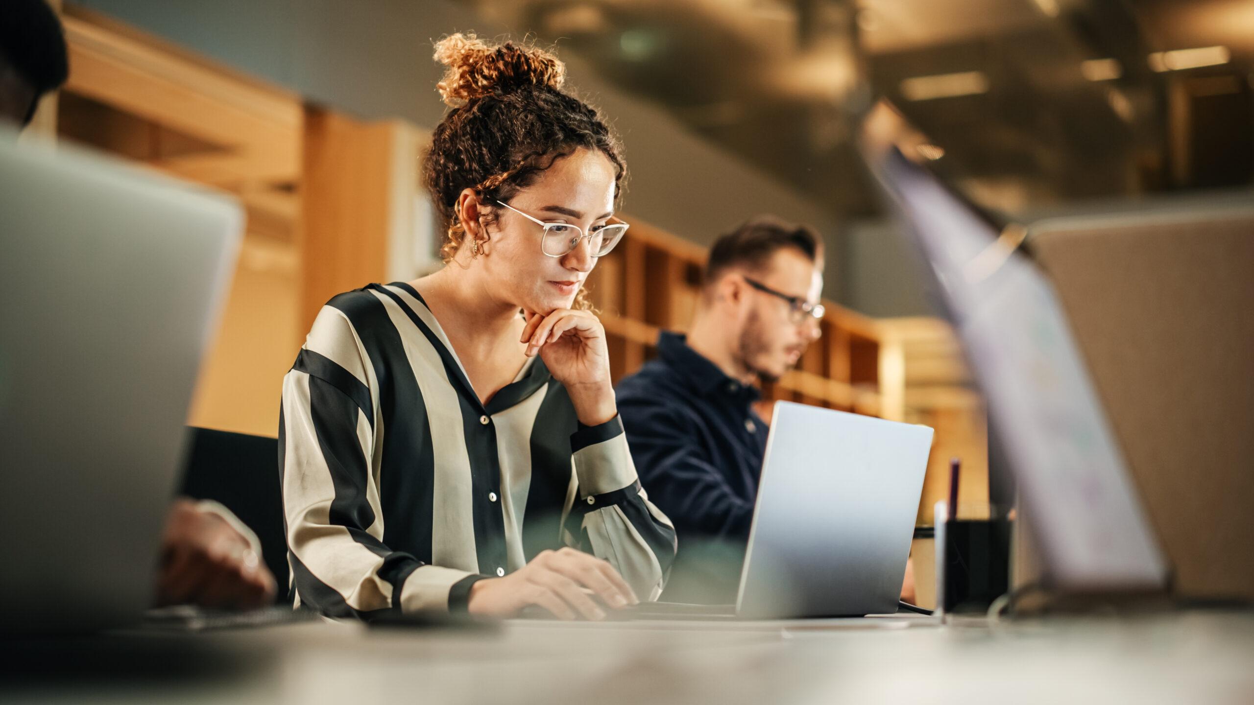Cordata team member collaborating at a laptop